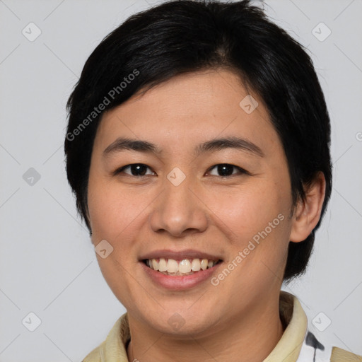 Joyful asian young-adult female with medium  black hair and brown eyes