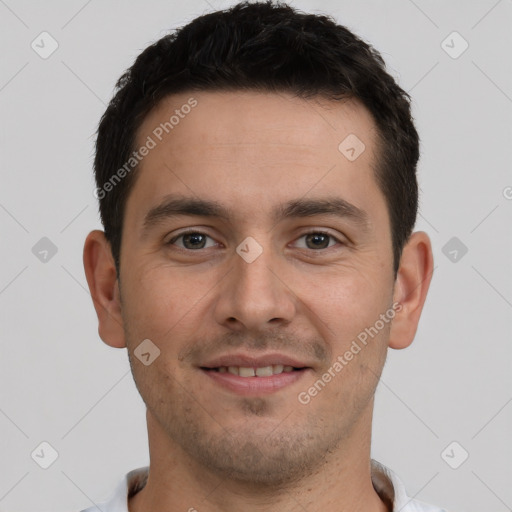 Joyful white young-adult male with short  brown hair and brown eyes