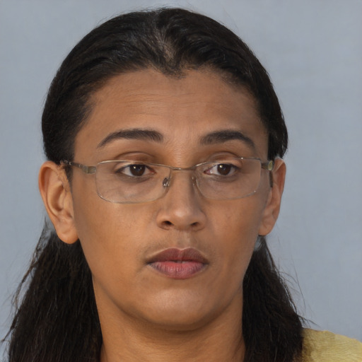 Neutral black adult female with long  brown hair and brown eyes