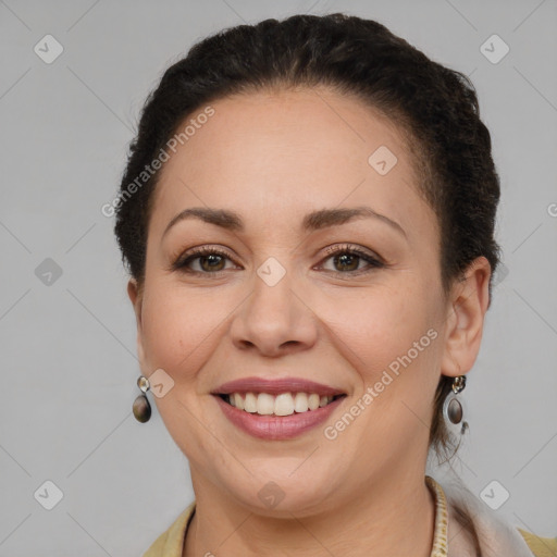 Joyful white adult female with short  brown hair and brown eyes