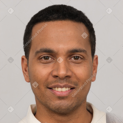 Joyful white young-adult male with short  black hair and brown eyes