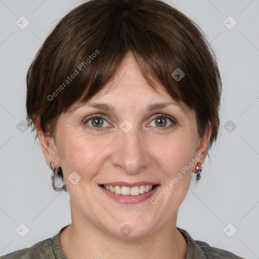 Joyful white adult female with medium  brown hair and grey eyes