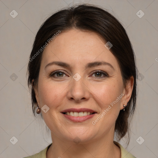 Joyful white adult female with medium  brown hair and brown eyes