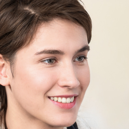 Joyful white young-adult male with medium  brown hair and brown eyes