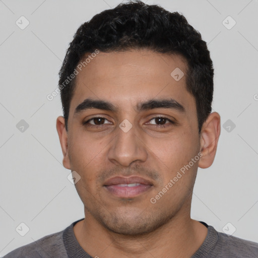 Neutral latino young-adult male with short  black hair and brown eyes