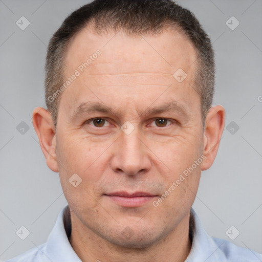 Joyful white adult male with short  brown hair and brown eyes