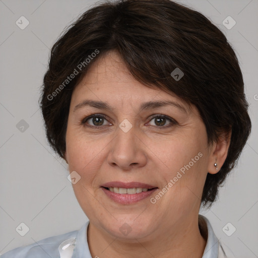 Joyful white adult female with medium  brown hair and brown eyes