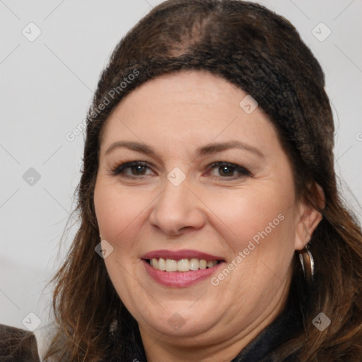 Joyful white adult female with medium  brown hair and brown eyes