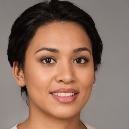 Joyful white young-adult female with medium  brown hair and brown eyes