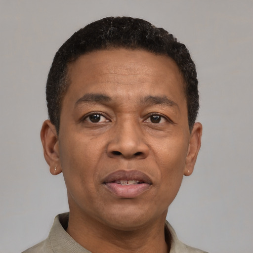 Neutral latino adult male with short  brown hair and brown eyes