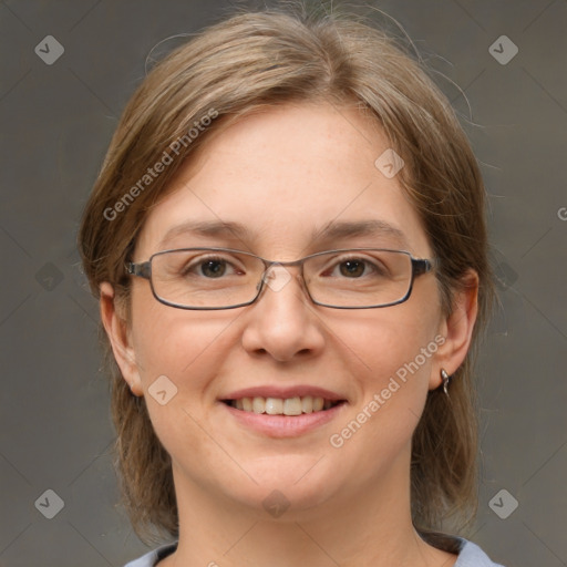 Joyful white adult female with medium  brown hair and grey eyes