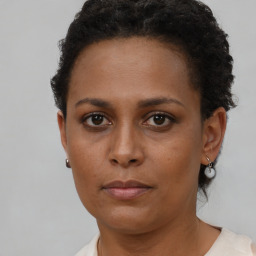 Neutral black young-adult female with short  brown hair and brown eyes