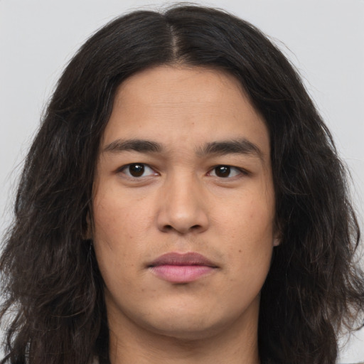 Neutral white young-adult male with long  brown hair and brown eyes