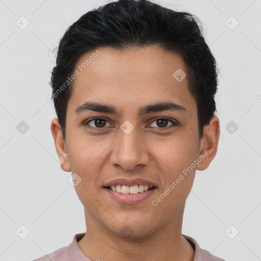 Joyful latino young-adult male with short  brown hair and brown eyes