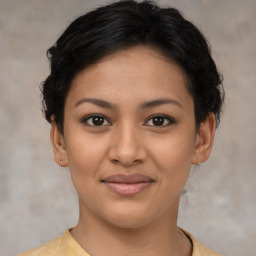 Joyful latino young-adult female with short  brown hair and brown eyes