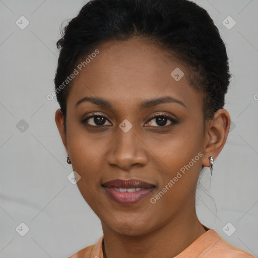 Joyful black young-adult female with short  brown hair and brown eyes