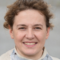 Joyful white adult female with short  brown hair and brown eyes