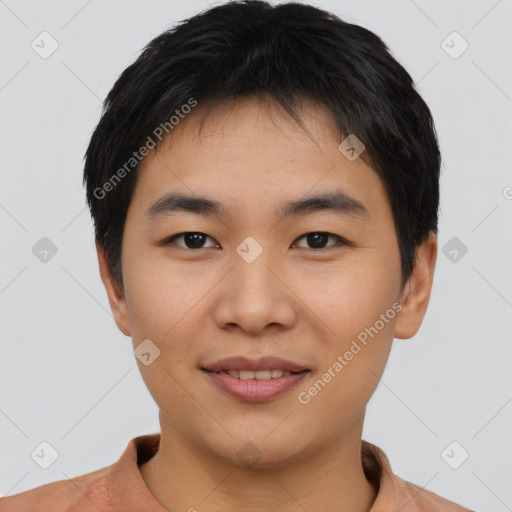 Joyful asian young-adult male with short  black hair and brown eyes