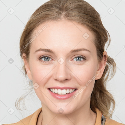 Joyful white young-adult female with medium  brown hair and blue eyes