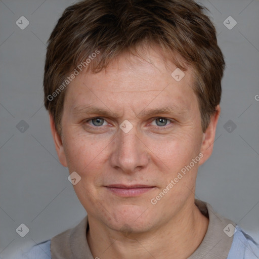 Joyful white adult male with short  brown hair and grey eyes