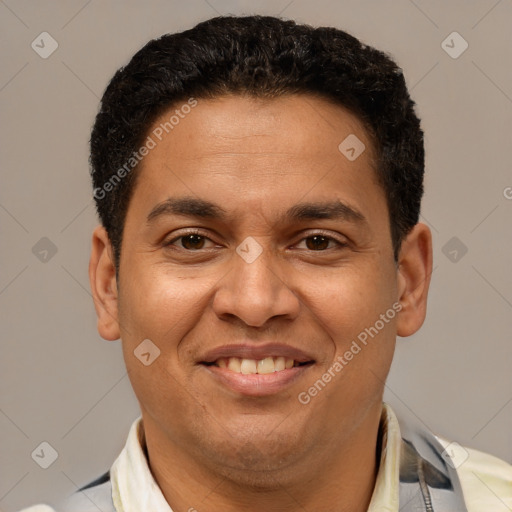 Joyful latino young-adult male with short  brown hair and brown eyes