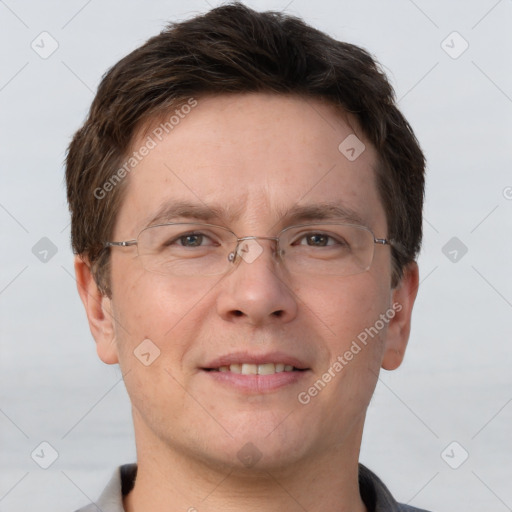 Joyful white adult male with short  brown hair and grey eyes