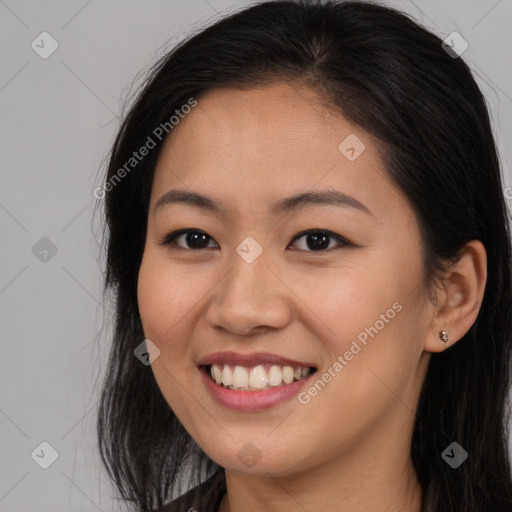 Joyful asian young-adult female with long  brown hair and brown eyes