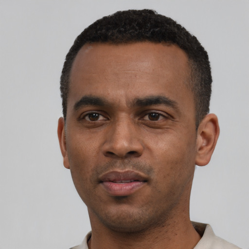 Neutral black young-adult male with short  black hair and brown eyes