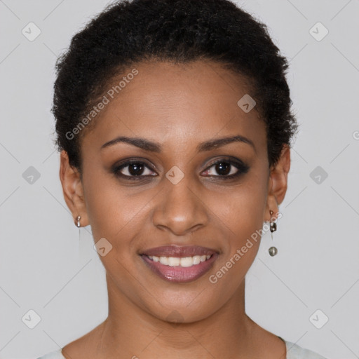 Joyful black young-adult female with short  brown hair and brown eyes