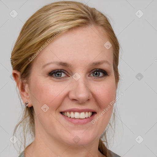 Joyful white young-adult female with medium  brown hair and blue eyes