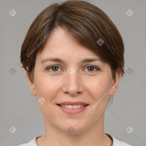 Joyful white young-adult female with short  brown hair and grey eyes