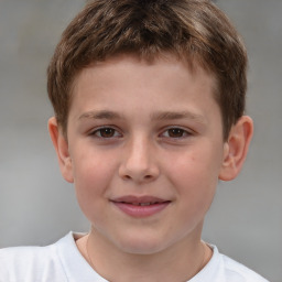 Joyful white child male with short  brown hair and brown eyes