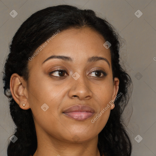 Joyful black young-adult female with long  brown hair and brown eyes