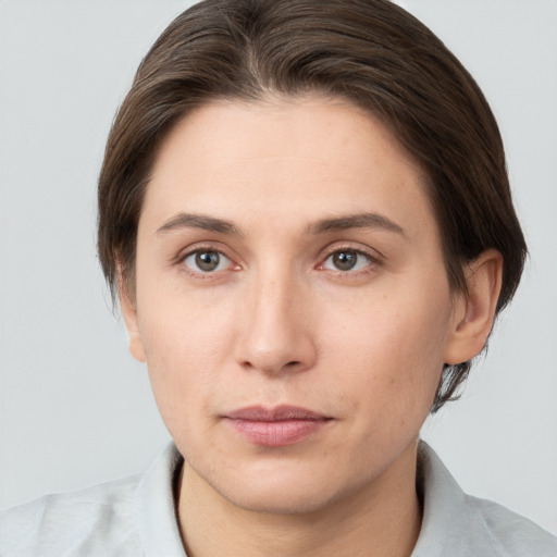 Neutral white young-adult female with short  brown hair and brown eyes