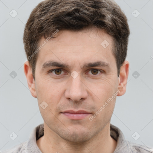 Joyful white adult male with short  brown hair and grey eyes