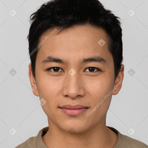 Joyful asian young-adult male with short  black hair and brown eyes