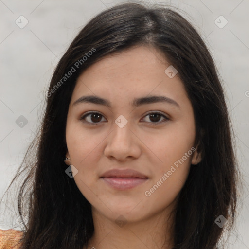 Joyful latino young-adult female with long  brown hair and brown eyes