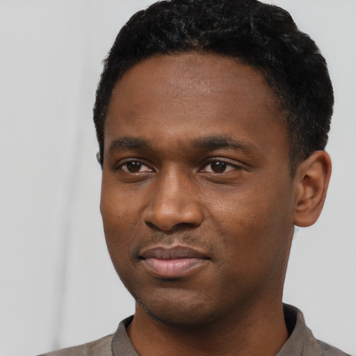 Neutral black young-adult male with short  black hair and brown eyes