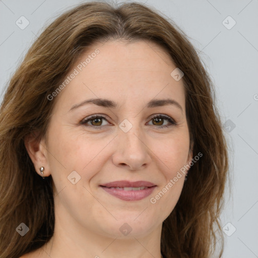 Joyful white adult female with long  brown hair and brown eyes