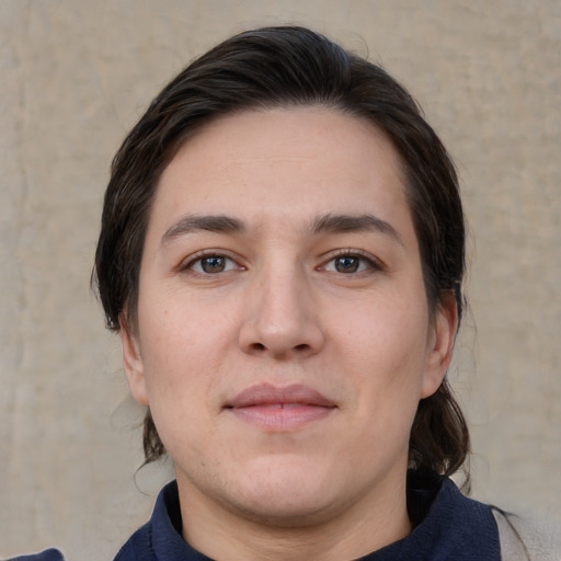 Joyful white young-adult male with medium  brown hair and brown eyes