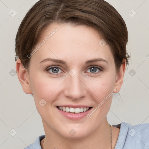 Joyful white young-adult female with short  brown hair and grey eyes