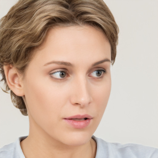 Neutral white young-adult female with short  brown hair and brown eyes