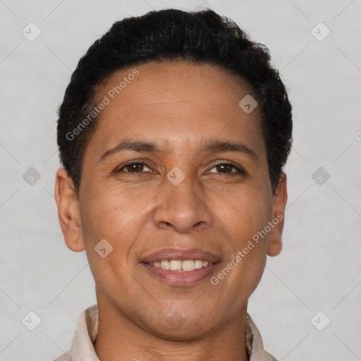 Joyful latino adult male with short  brown hair and brown eyes