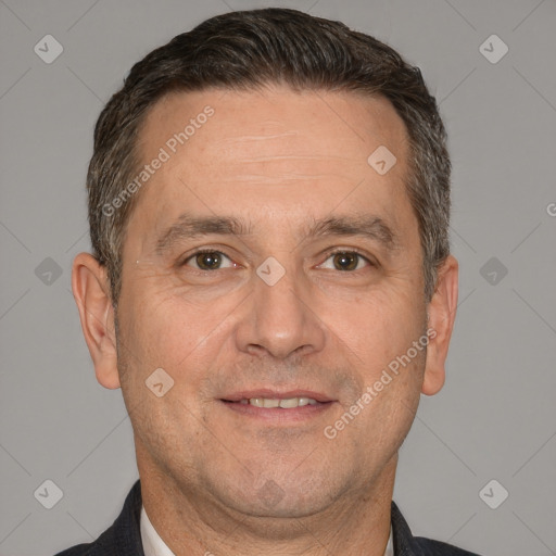 Joyful white adult male with short  brown hair and brown eyes