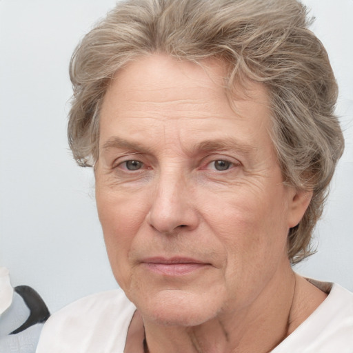 Joyful white middle-aged female with short  brown hair and grey eyes