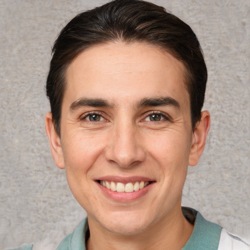 Joyful white adult male with short  brown hair and brown eyes