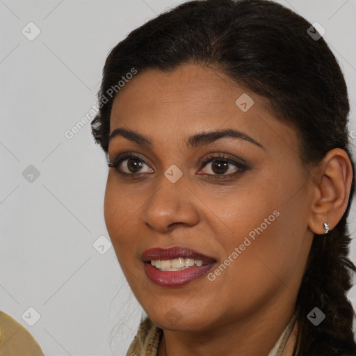 Joyful black young-adult female with medium  brown hair and brown eyes