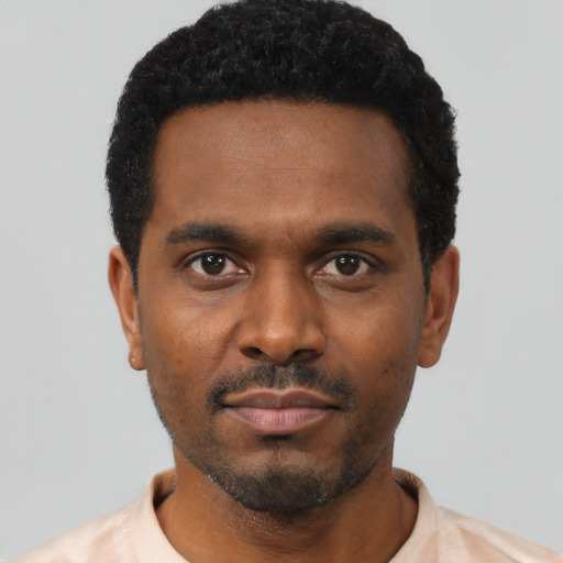 Neutral black young-adult male with short  black hair and brown eyes