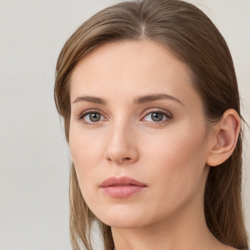 Neutral white young-adult female with long  brown hair and grey eyes