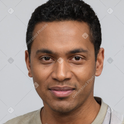 Joyful black young-adult male with short  black hair and brown eyes